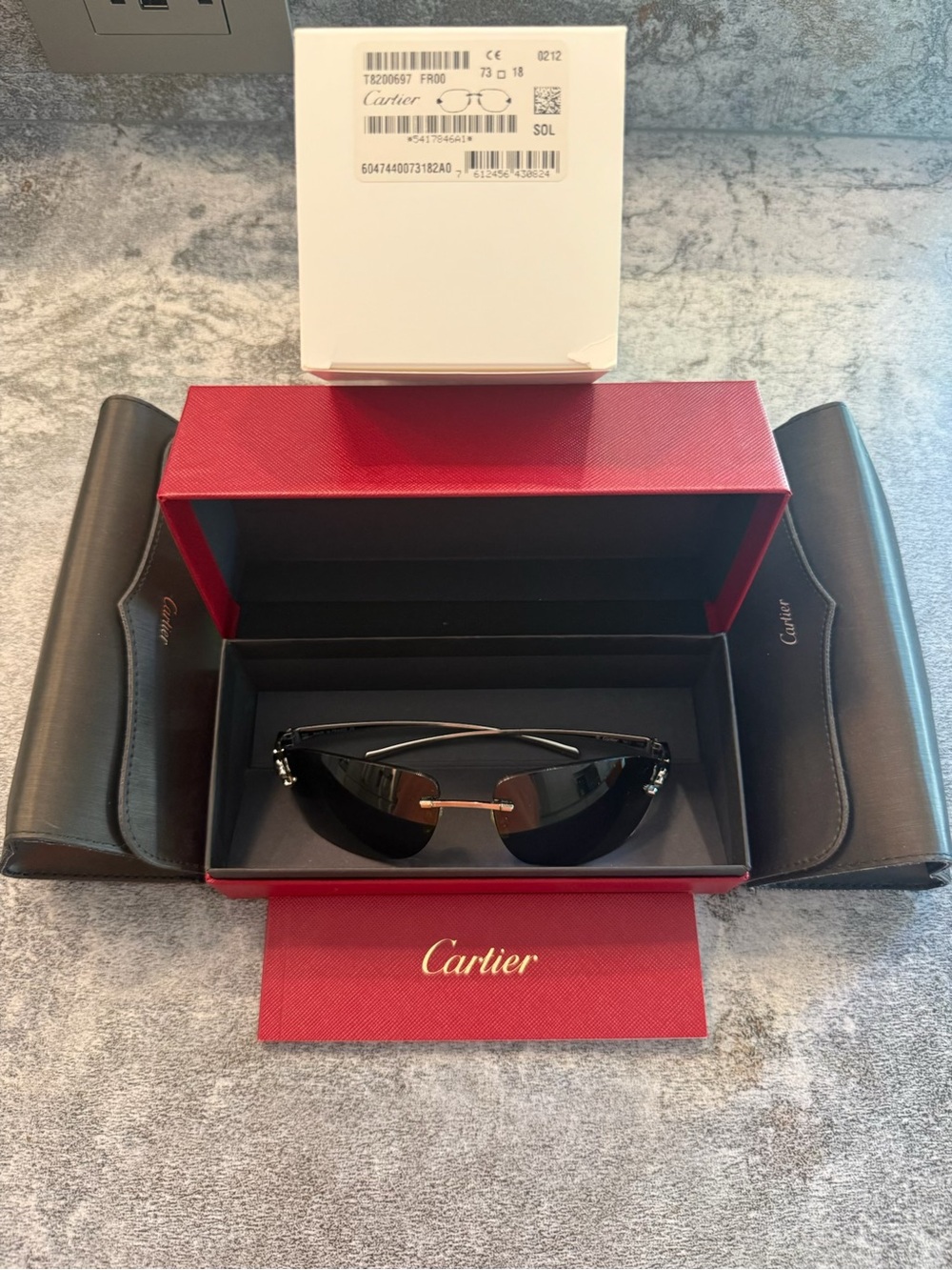 Cartier Black Sunglasses with Gold Bridge and Accents